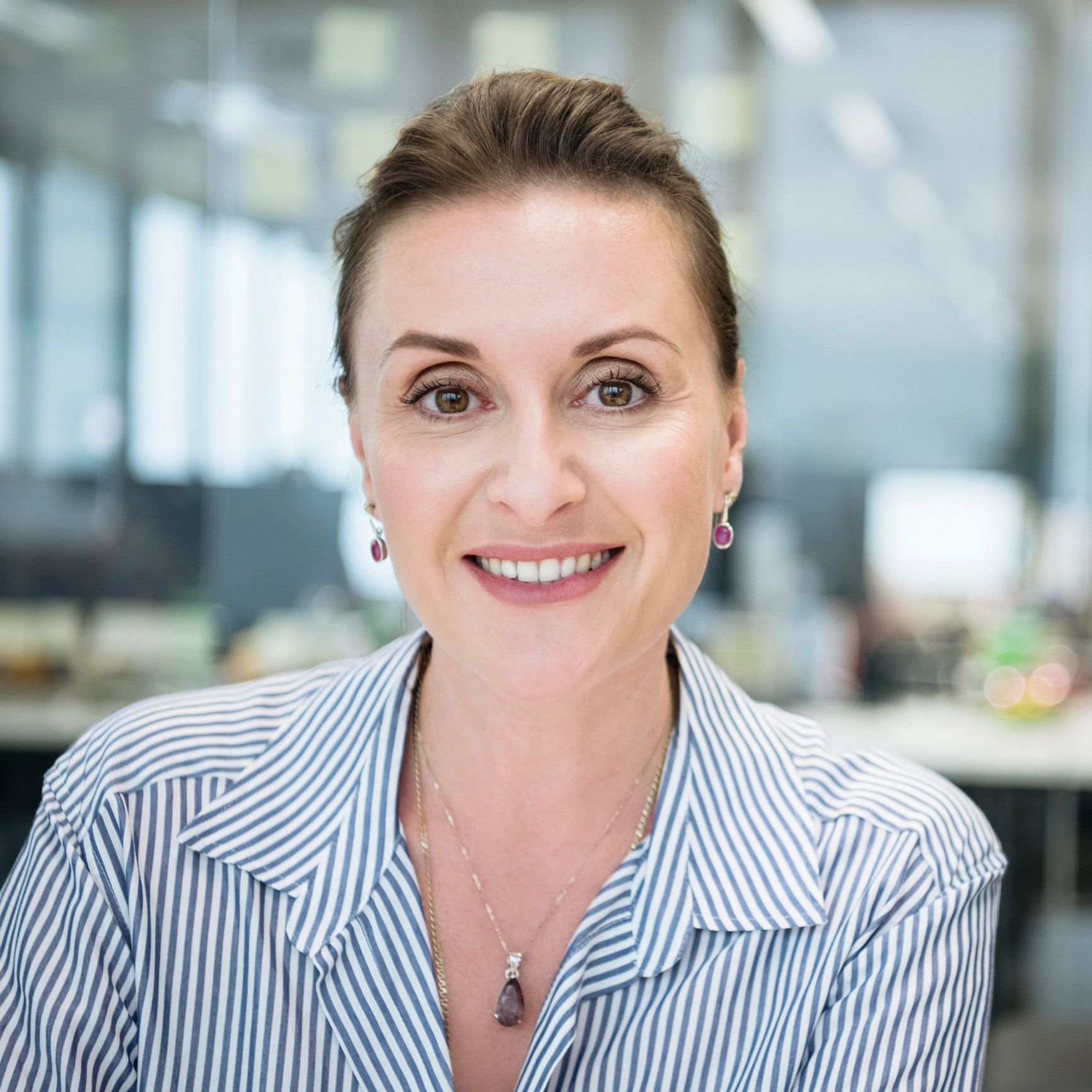 Professional headshot of a businesswoman smiling